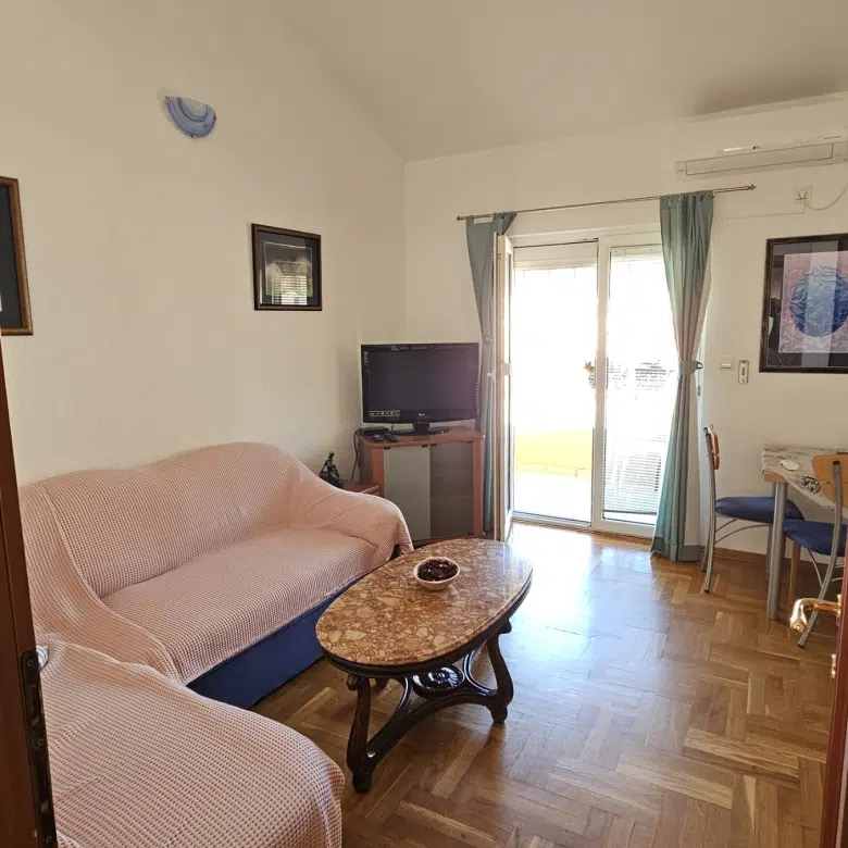 one-bedroom apartment Rafailovići, apartment for sale Rafailovići, Budva Riviera property, 1-bedroom near beach Montenegro, Rafailovići real estate for sale, apartment 100m from sea, Vitodolska Turistička apartment, third-floor attic apartment, terrace apartment Rafailovići, optional garage parking, 14 m2 parking space Rafailovići, Montenegro coastal property, holiday rental potential Budva, small apartment for investment Montenegro, violet investment