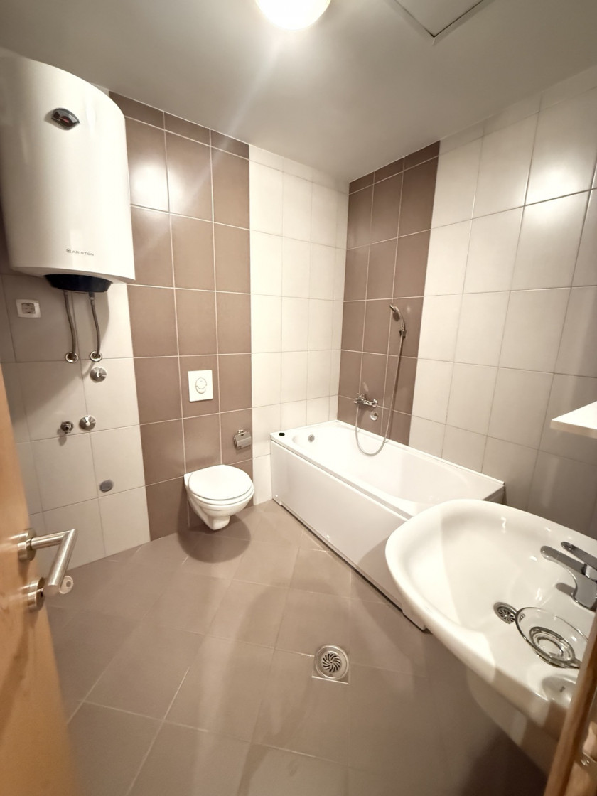 apartment for sale Podgorica, one bedroom apartment Podgorica, Ljubović apartment for sale, Aleksandra Divajna 1 Podgorica, Gradnja Promet building, 49 m2 apartment Podgorica, apartment with garage Podgorica, underground parking Podgorica, air conditioned apartment Podgorica, terrace apartment Podgorica, energy label B apartment, investment apartment Podgorica, rented apartment for sale Podgorica, quiet neighborhood Ljubović, near Capital Plaza Podgorica, near Delta City Podgorica, nekretnine Podgorica prodaja, jednosoban stan Ljubović, stan sa garažnim mjestom Podgorica, stan u novijoj zgradi Podgorica