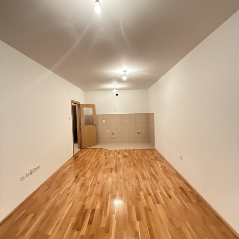 apartment for sale Podgorica, one bedroom apartment Podgorica, Ljubović apartment for sale, Aleksandra Divajna 1 Podgorica, Gradnja Promet building, 49 m2 apartment Podgorica, apartment with garage Podgorica, underground parking Podgorica, air conditioned apartment Podgorica, terrace apartment Podgorica, energy label B apartment, investment apartment Podgorica, rented apartment for sale Podgorica, quiet neighborhood Ljubović, near Capital Plaza Podgorica, near Delta City Podgorica, nekretnine Podgorica prodaja, jednosoban stan Ljubović, stan sa garažnim mjestom Podgorica, stan u novijoj zgradi Podgorica