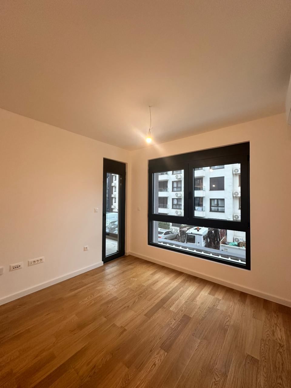 apartment for sale Bar, one bedroom apartment near beach, 45 m2 new apartment Montenegro, brand new flat October 2025, apartment near Anto Đedović school, apartment next to Aroma store Bar, first floor apartment Montenegro, underfloor heating apartment, wooden floors apartment Bar, 1 bedroom flat with balcony, partial sea view apartment, new building near beach Bar, for sale by owner Montenegro, holiday home Bar Montenegro, investment apartment near sea, apartment with underground parking option, quiet apartment not on main road, nekretnine Bar prodaja, jednosoban stan novogradnja Bar, stan blizu mora i škole Bar, violet investment, violet investment montenegro