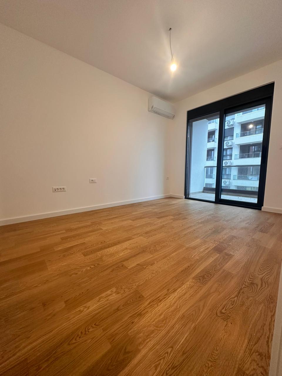 apartment for sale Bar, one bedroom apartment near beach, 45 m2 new apartment Montenegro, brand new flat October 2025, apartment near Anto Đedović school, apartment next to Aroma store Bar, first floor apartment Montenegro, underfloor heating apartment, wooden floors apartment Bar, 1 bedroom flat with balcony, partial sea view apartment, new building near beach Bar, for sale by owner Montenegro, holiday home Bar Montenegro, investment apartment near sea, apartment with underground parking option, quiet apartment not on main road, nekretnine Bar prodaja, jednosoban stan novogradnja Bar, stan blizu mora i škole Bar, violet investment, violet investment montenegro