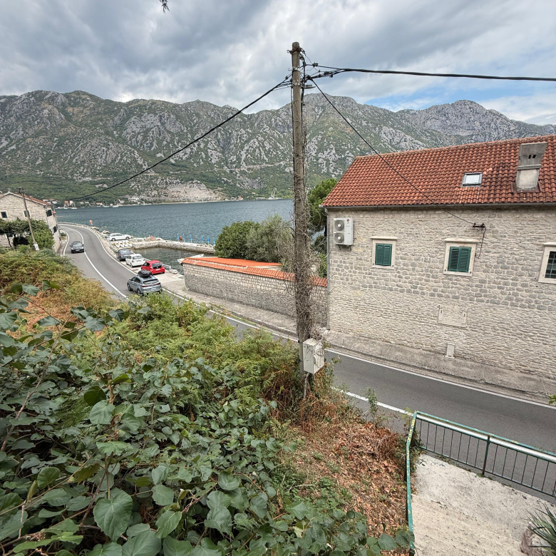 seafront house for sale Kotor, waterfront property Kostanjica, first line to the sea Montenegro, house with private ponta Montenegro, 200 m2 house 1700 m2 land, large seafront plot Kotor Bay, luxury villa potential Montenegro, investment property Bay of Kotor, seaside house Montenegro for sale, property with mooring Montenegro, urbanized land with house Kotor, house with terraces sea view Montenegro, exclusive coastal property Montenegro, nekretnine Kotor prodaja, kuća na moru Kostanjica, kuća prvi red do mora Boka, plac uz more Crna Gora, kuća sa pontom Crna Gora, investiciona nekretnina na obali Crne Gore, violet investment, violet investment montenegro