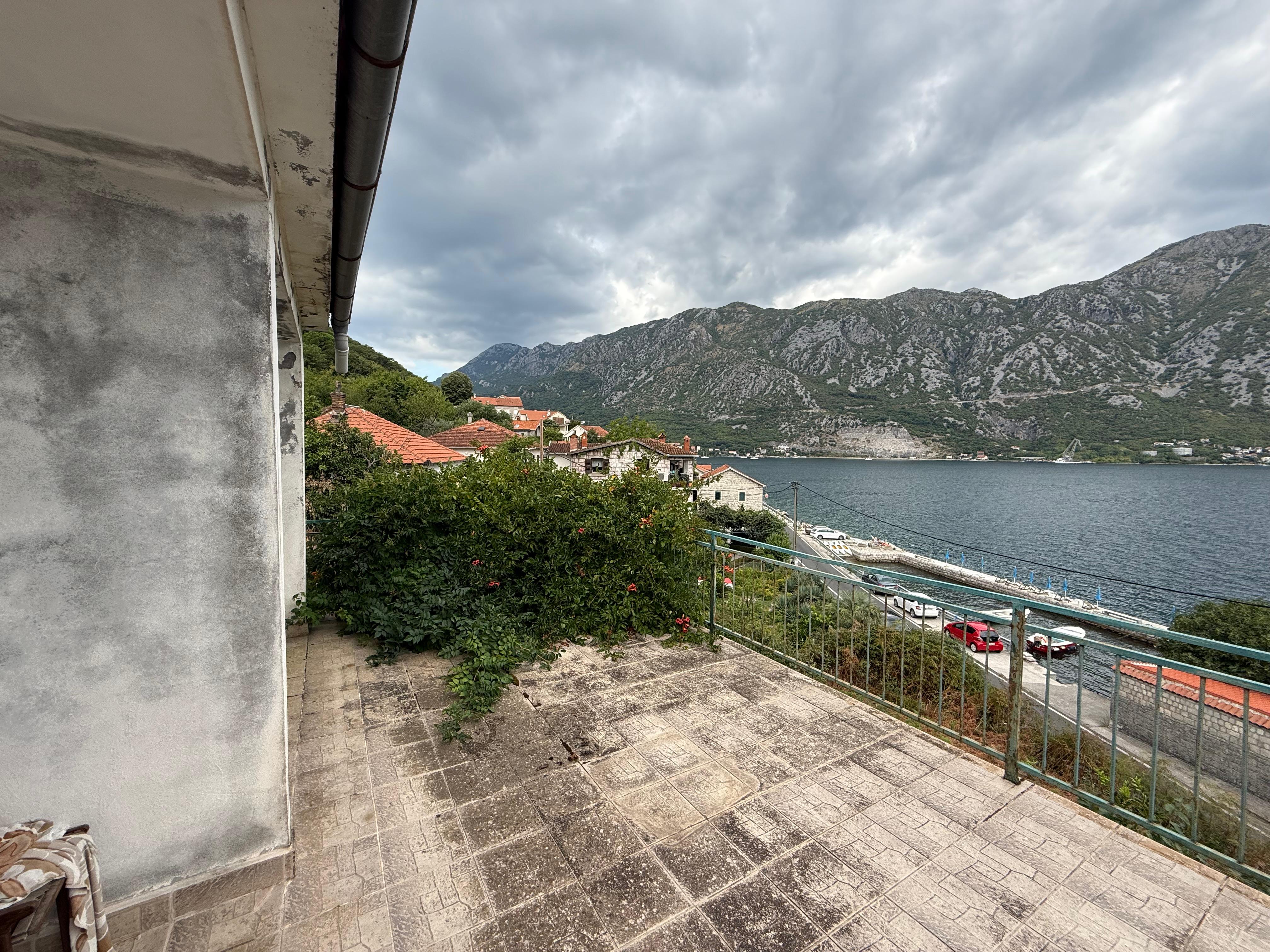 seafront house for sale Kotor, waterfront property Kostanjica, first line to the sea Montenegro, house with private ponta Montenegro, 200 m2 house 1700 m2 land, large seafront plot Kotor Bay, luxury villa potential Montenegro, investment property Bay of Kotor, seaside house Montenegro for sale, property with mooring Montenegro, urbanized land with house Kotor, house with terraces sea view Montenegro, exclusive coastal property Montenegro, nekretnine Kotor prodaja, kuća na moru Kostanjica, kuća prvi red do mora Boka, plac uz more Crna Gora, kuća sa pontom Crna Gora, investiciona nekretnina na obali Crne Gore