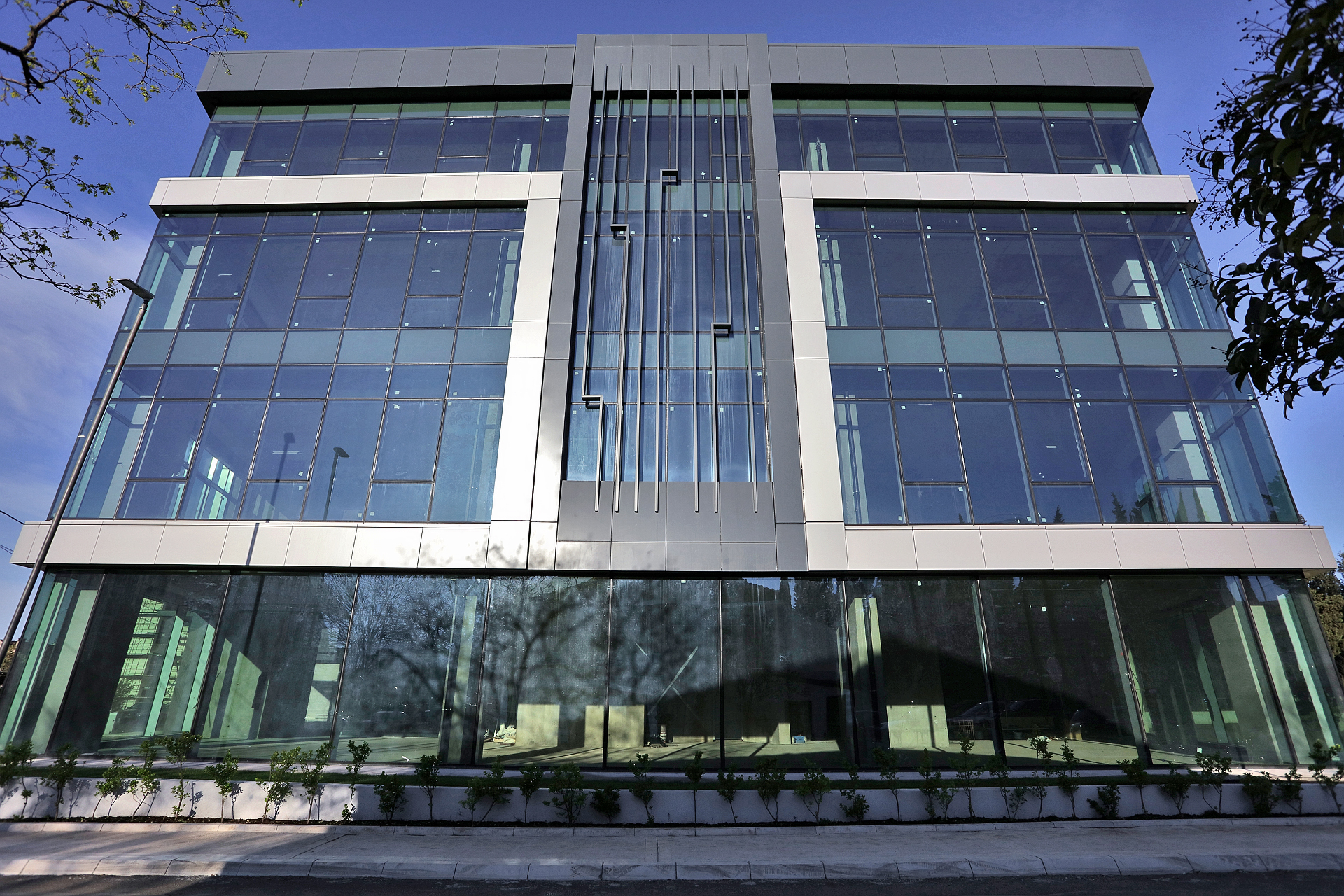 office building for sale, office building for rent, Grade A office building, prime commercial building, full building lease opportunity, corporate headquarters building, shell and core ground floor, Reynaers CS77 façade, HP Sunguard Neutral glass, office with backup generator, office building with CCTV, building with underground parking, KONE elevators office property, secure office with card access, commercial real estate investment, modern office space with high ceilings, mixed lease and sale options, office building with green areas, business property with storage and parking, violet investment,violet investment montenegro