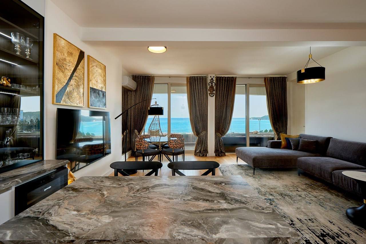 luxury apartment for sale Montenegro, Skyline complex first line to the sea, 1 bedroom sea view apartment 73 m2, panoramic sea view apartment, private lift to the beach, apartment with large terrace Adriatic coast, furnished designer apartment Montenegro, apartment with pools and concierge, rental management property Montenegro, holiday home sea view, investment apartment Montenegro coast, luxury resort-style living, nekretnine na moru prodaja, lux apartman Skyline, stan prvi red do mora, panorama stan sa terasom, apartman sa bazenima i restoranom, investiciona nekretnina Crna Gora,violet investment,violet investment montenegro