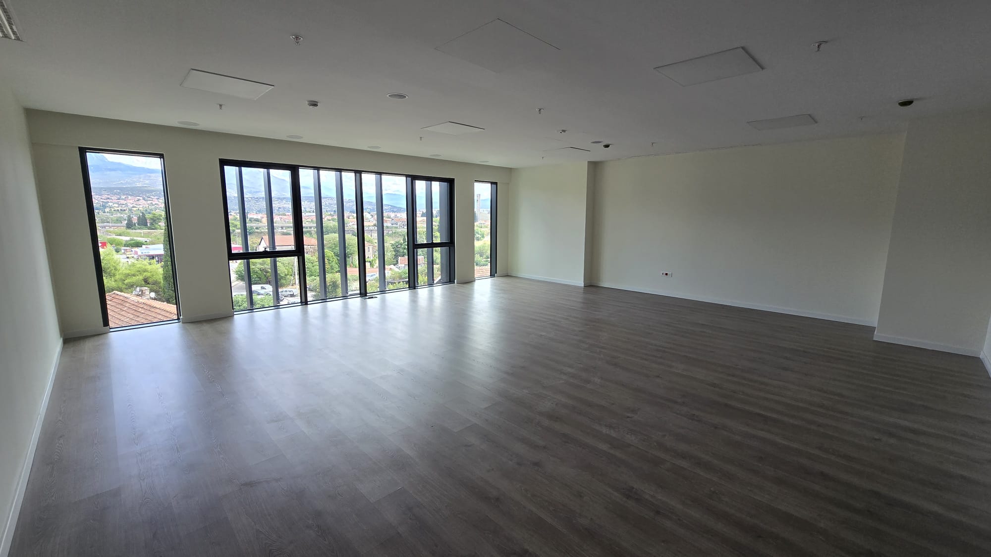 office building for sale, office building for rent, Grade A office building, prime commercial building, full building lease opportunity, corporate headquarters building, shell and core ground floor, Reynaers CS77 façade, HP Sunguard Neutral glass, office with backup generator, office building with CCTV, building with underground parking, KONE elevators office property, secure office with card access, commercial real estate investment, modern office space with high ceilings, mixed lease and sale options, office building with green areas, business property with storage and parking, violet investment,violet investment montenegro