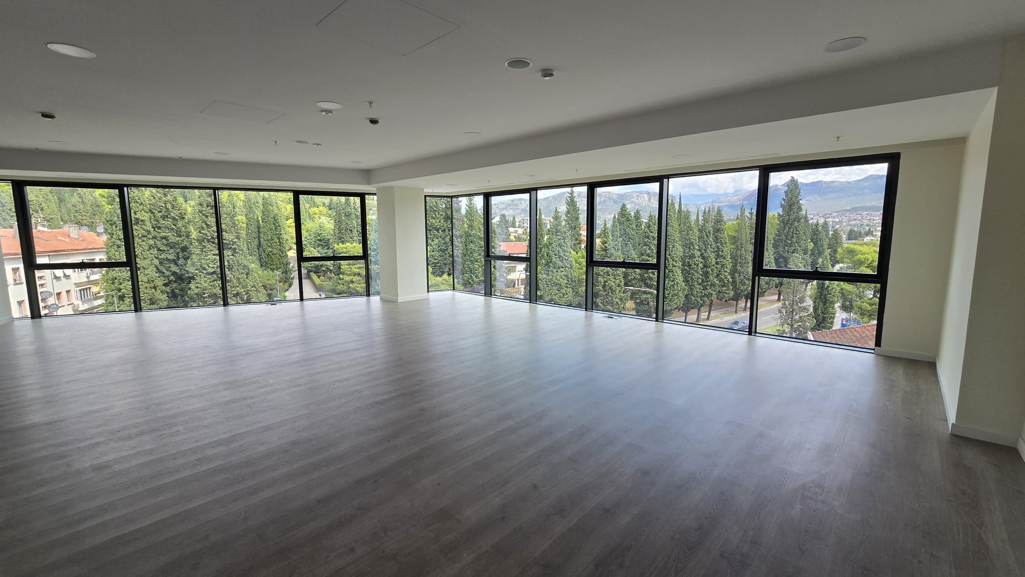 office building for sale, office building for rent, Grade A office building, prime commercial building, full building lease opportunity, corporate headquarters building, shell and core ground floor, Reynaers CS77 façade, HP Sunguard Neutral glass, office with backup generator, office building with CCTV, building with underground parking, KONE elevators office property, secure office with card access, commercial real estate investment, modern office space with high ceilings, mixed lease and sale options, office building with green areas, business property with storage and parking, violet investment,violet investment montenegro