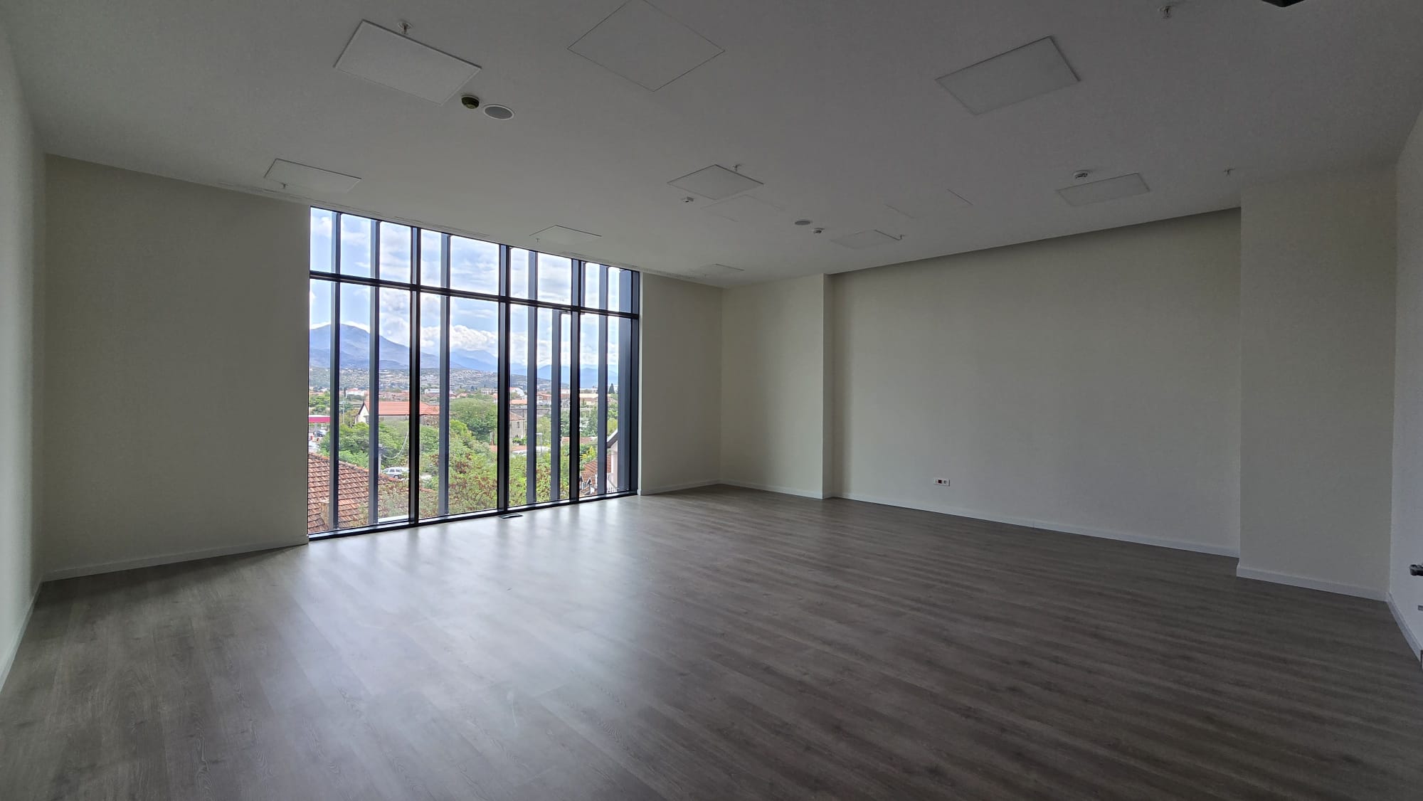 office building for sale, office building for rent, Grade A office building, prime commercial building, full building lease opportunity, corporate headquarters building, shell and core ground floor, Reynaers CS77 façade, HP Sunguard Neutral glass, office with backup generator, office building with CCTV, building with underground parking, KONE elevators office property, secure office with card access, commercial real estate investment, modern office space with high ceilings, mixed lease and sale options, office building with green areas, business property with storage and parking, violet investment,violet investment montenegro