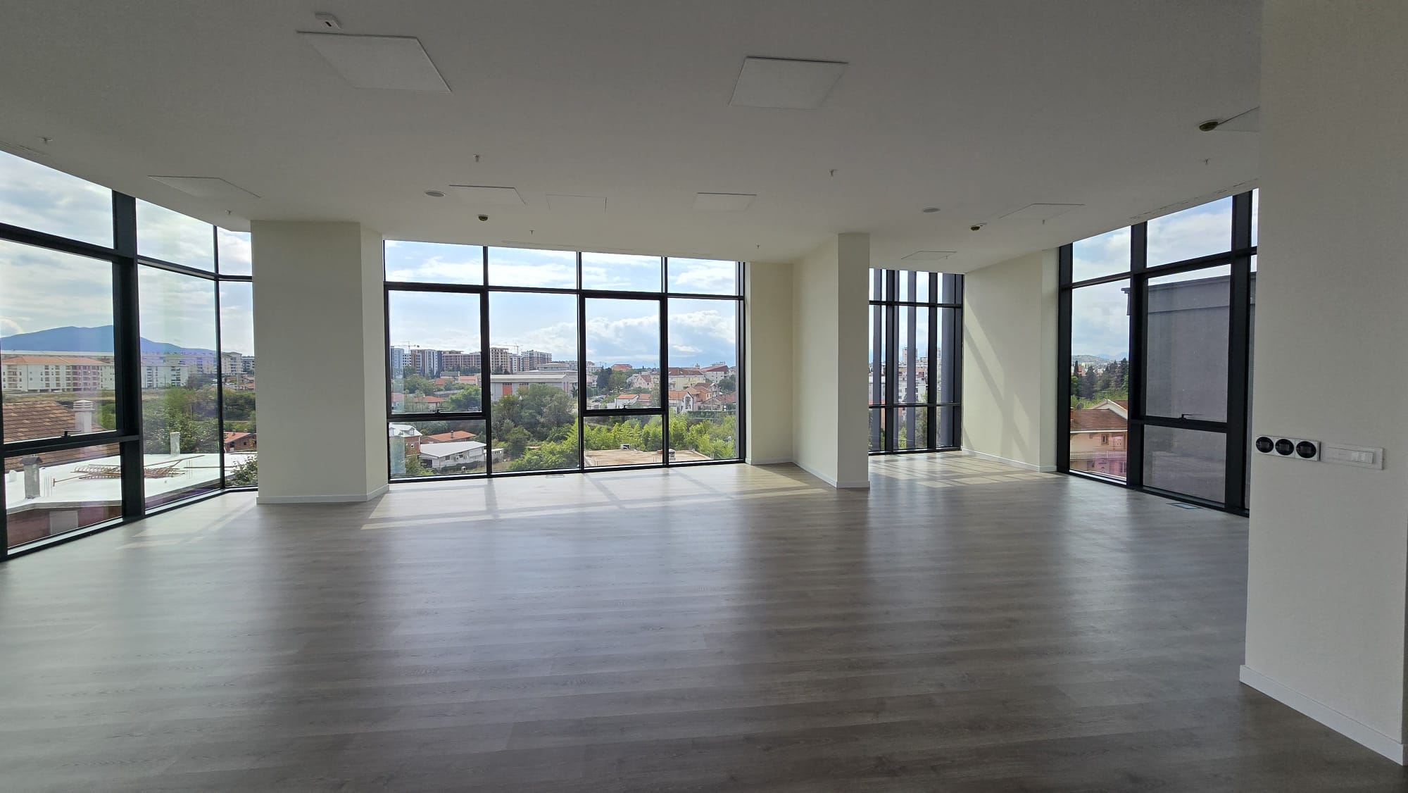 office building for sale, office building for rent, Grade A office building, prime commercial building, full building lease opportunity, corporate headquarters building, shell and core ground floor, Reynaers CS77 façade, HP Sunguard Neutral glass, office with backup generator, office building with CCTV, building with underground parking, KONE elevators office property, secure office with card access, commercial real estate investment, modern office space with high ceilings, mixed lease and sale options, office building with green areas, business property with storage and parking, violet investment,violet investment montenegro