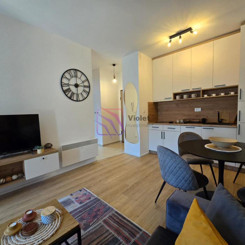 A modern apartment for sale in Kolašin, located in the quality Eurozox residential building, offering comfort, functionality, and excellent investment potential in one of Montenegro’s most popular mountain destinations. The apartment is move-in ready, with clean ownership documents, making the purchase process simple and secure. Property Highlights Location: Eurozox building, Kolašin Floor: 1st floor Orientation: South-facing (bright and sunny) Heating: Underfloor heating + Bosch radiators Cooling: Gree 18 air conditioning unit Kitchen: Fully equipped with all appliances Parking: Private parking space in underground garage Documentation: Clean papers, ready for sale Condition: Fully equipped, ready to move in Features & Equipment Underfloor heating system 3 Bosch radiators Gree 18 air conditioning Complete white goods included Bright interior thanks to southern orientation Comfortable temperature throughout the year Quality residential building Location Advantages Kolašin is one of Montenegro’s fastest-growing destinations, known for: Ski resorts Kolašin 1450 and Kolašin 1600 Beautiful mountain nature Year-round tourism potential Strong rental demand (winter and summer seasons) Investment Potential This property is ideal for: Holiday apartment in the mountains Rental investment (ski tourism) Private residence in a peaceful environment Apartments in Kolašin are increasingly popular due to the development of mountain tourism and infrastructure. FAQ — Apartment in Kolašin (Eurozox Building) 1) Where is the apartment located? In the Eurozox building in Kolašin. 2) Is the apartment ready to move in? Yes, the apartment is fully equipped and immediately available. 3) What heating system is installed? The apartment includes underfloor heating and Bosch radiators. 4) Does the apartment have air conditioning? Yes, it has a Gree 18 air conditioning unit. 5) Is parking included? Yes, the apartment includes a parking space in the underground garage. 6) Is the apartment sunny? Yes, it has south orientation, providing plenty of natural light. 7) Are documents in order? Yes, the property has clean ownership documentation. 8) Is this a good investment? Yes, Kolašin is a popular mountain destination with strong rental demand. 9) What appliances are included? All white goods and kitchen appliances are included. 10) Who is this property ideal for? Ideal for investors, holiday home buyers, or those seeking mountain living, violet investment