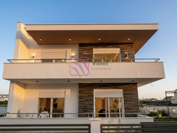 A modern family house for sale in Štoj, Ulcinj, offering the perfect balance of comfort, functionality, and privacy. With a total living area of 168 m² and a 250 m² landscaped yard, this property is ideal for family living, holiday use, or investment near the Adriatic coast. Located in a quiet residential area, the house is only a few minutes’ drive from the beach, providing a relaxed Mediterranean lifestyle. Property Overview Living area: 168 m² Land area: 250 m² Bedrooms: 4 Bathrooms: 2 Floors: 2 levels connected by internal staircase Parking: Covered parking for 2 vehicles Condition: Modern, fully equipped Location: Quiet neighborhood near the beach Interior Layout The house is carefully designed for comfortable family living, including: Spacious living room with kitchen and dining area Four bedrooms Two bathrooms Laundry room with new washing machine Functional layout with good separation of living and sleeping areas Features & Equipment Fully equipped modern kitchen with appliances Complete air conditioning system Travertine wall finishes Lowered ceilings with LED lighting High-quality materials and contemporary design Bright and comfortable interior spaces Outdoor Area 250 m² landscaped yard Outdoor and indoor lighting system Covered parking for 2 vehicles Possibility to build a swimming pool without reducing parking or green areas Location Štoj is a peaceful residential area near Ulcinj, known for: Long sandy beaches Natural surroundings and privacy Relaxed coastal atmosphere Increasing demand for residential properties The property is only a few minutes’ drive from the sea and local amenities. Investment Potential This property offers strong potential for: Permanent family residence Holiday home near the coast Rental investment during tourist season Future value increase due to location development FAQ — House in Štoj (168 m²) 1) What is for sale? A modern two-level family house of 168 m² in Štoj, Ulcinj. 2) How many bedrooms and bathrooms does the house have? The house includes 4 bedrooms and 2 bathrooms. 3) Does the property have parking? Yes, it includes covered parking for 2 vehicles. 4) Is the house furnished? The house is equipped with modern kitchen and appliances. 5) Is air conditioning installed? Yes, the property has complete air conditioning. 6) Can a swimming pool be built? Yes, the plot layout allows construction of a pool without affecting parking or yard space. 7) Is the location quiet? Yes, the property is located in a peaceful residential area. 8) How far is the beach? The beach is only a few minutes’ drive away. 9) Is the property suitable for investment? Yes, it is ideal for holiday rental or long-term value. 10) Who is this property ideal for? Ideal for families, investors, or buyers seeking a modern home near the sea, violet investment